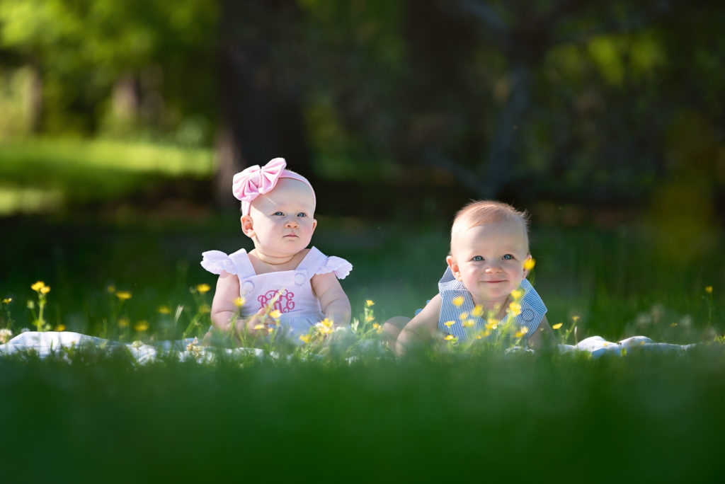 Twin Babies In The Grass